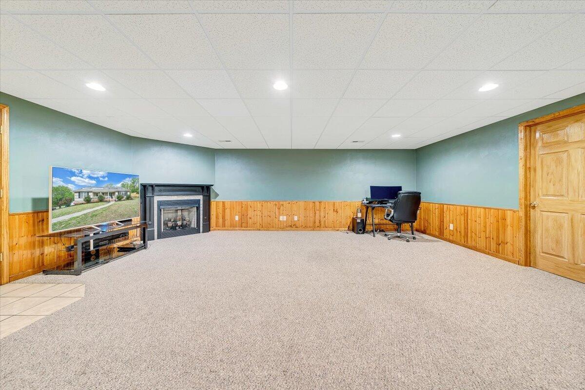 686 Pine Haven Road Fincastle, VA 24090 - Photo 38 of 56 a bed room with furniture and a flat screen tv