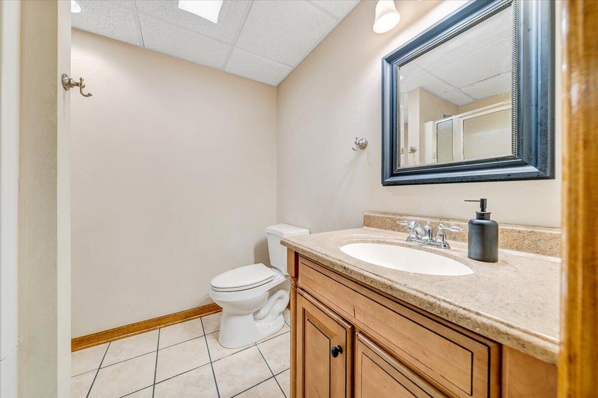 686 Pine Haven Road Fincastle, VA 24090 - Photo 41 of 56 a bathroom with a granite countertop sink vanity mirror and toilet