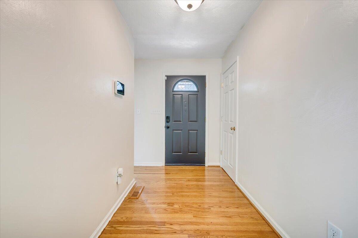 686 Pine Haven Road Fincastle, VA 24090 - Photo 5 of 56 a view of a hallway with wooden floor