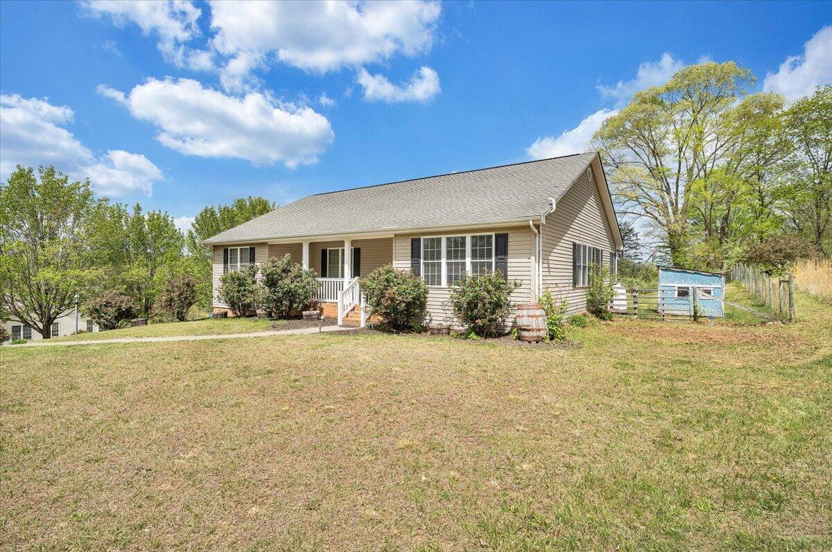 686 Pine Haven Road Fincastle, VA 24090 - Photo 55 of 56 a view of a house with a yard and potted plants