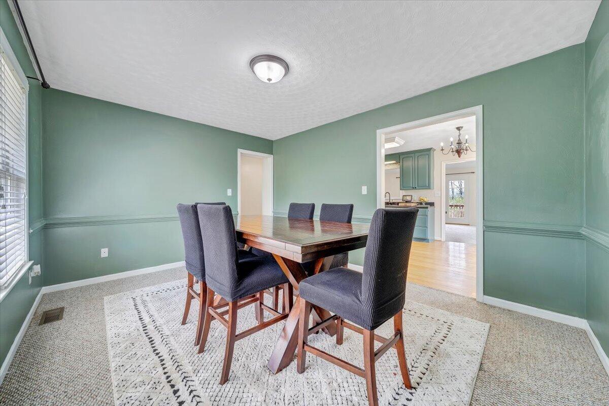 686 Pine Haven Road Fincastle, VA 24090 - Photo 8 of 56 a view of a dining room with furniture and wooden floor