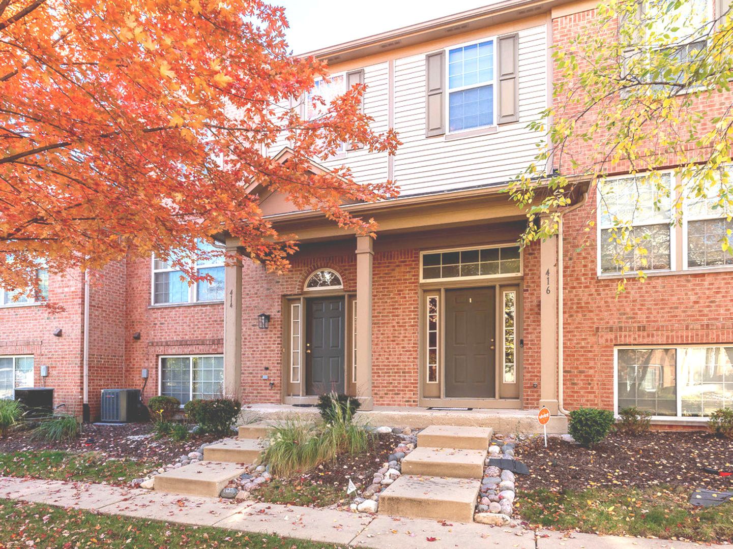 416 Conservatory Lane Aurora, IL 60502 - Photo 1 of 17 a front view of a house with a yard