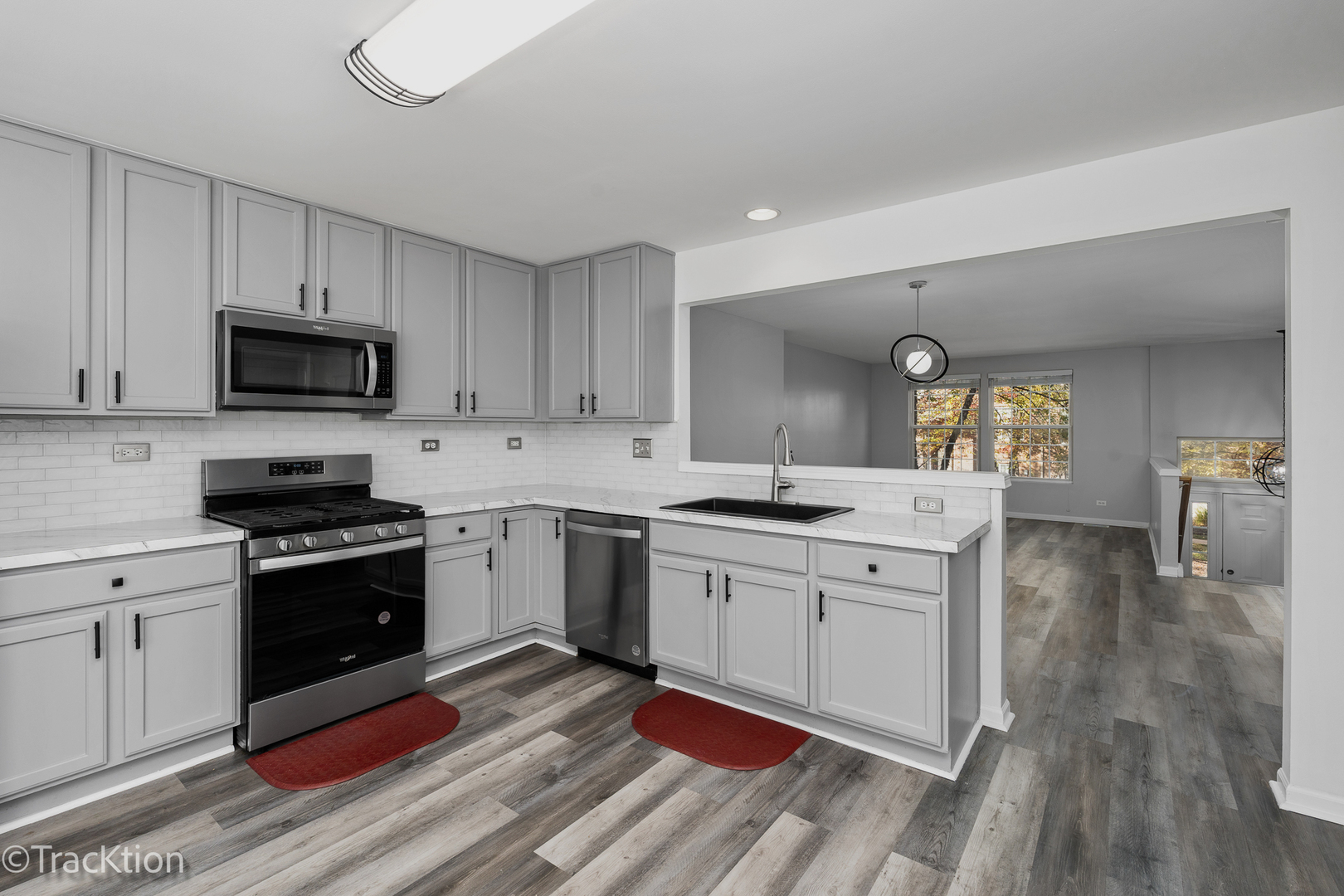416 Conservatory Lane Aurora, IL 60502 - Photo 6 of 17 a kitchen with a sink stove and cabinets