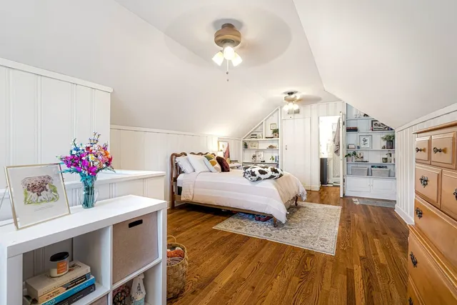 a bedroom with furniture and a chandelier