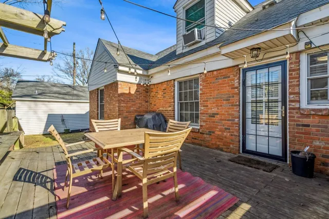 a view of a patio with table and chairs and potted plants