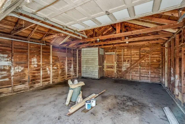 a view of a room with wooden walls