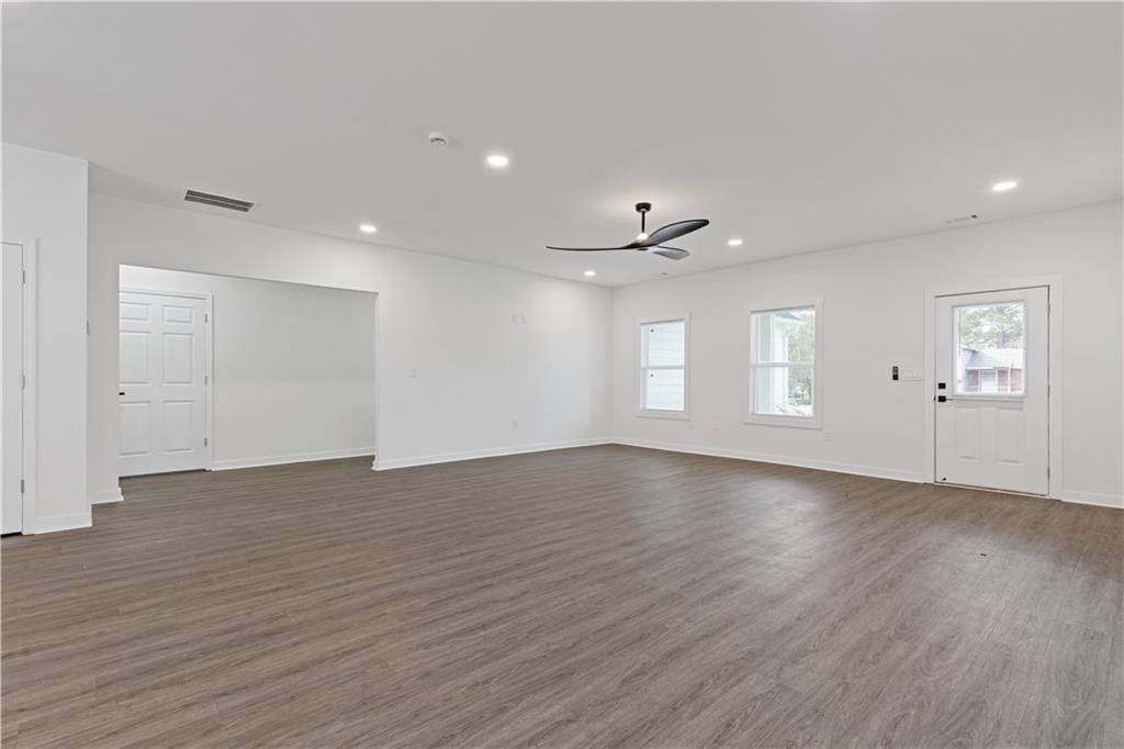 3272 Corktree Trail Lithonia, GA 30038 - Photo 8 of 22 an empty room with wooden floor and window
