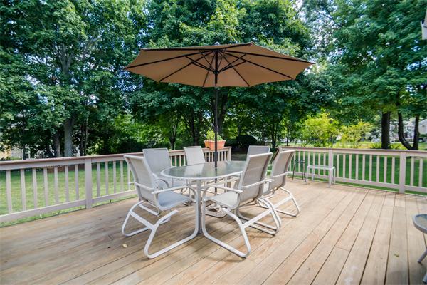 6 James Road Reading, MA 01867 - Photo 24 of 30 a view of a chair and table on the wooden deck