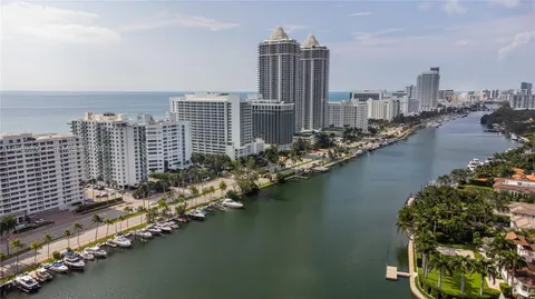 a living room with lots of furniture wooden floor and a table