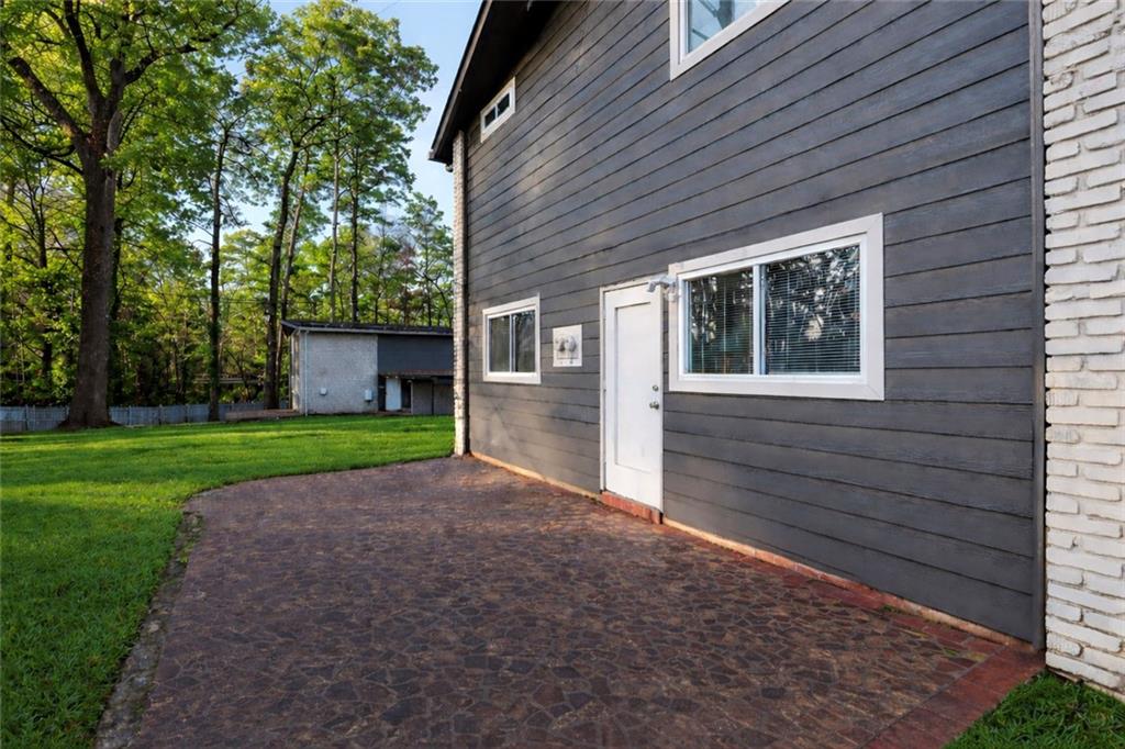 a view of a house with a back yard