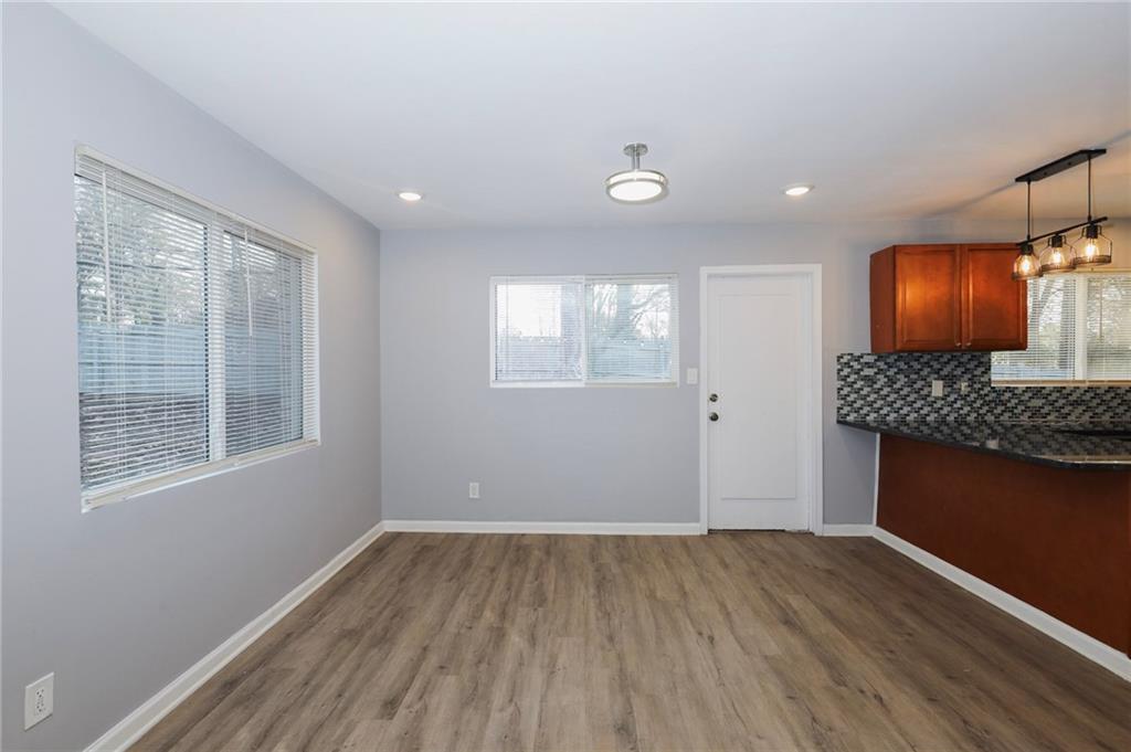 1277 Goodwin Road Northeast, Unit 1273 Atlanta, GA 30324 - Photo 4 of 18 a view of room with window and wooden floor
