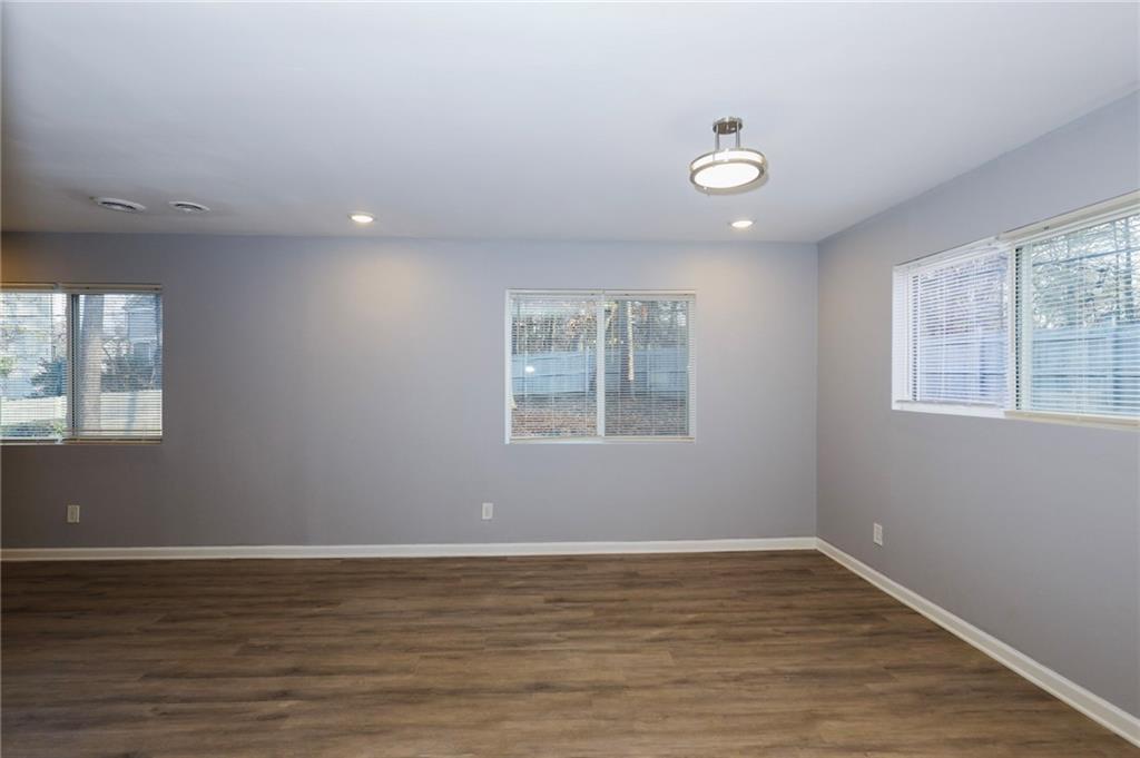 1277 Goodwin Road Northeast, Unit 1273 Atlanta, GA 30324 - Photo 5 of 18 a view of a room with window and wooden floor