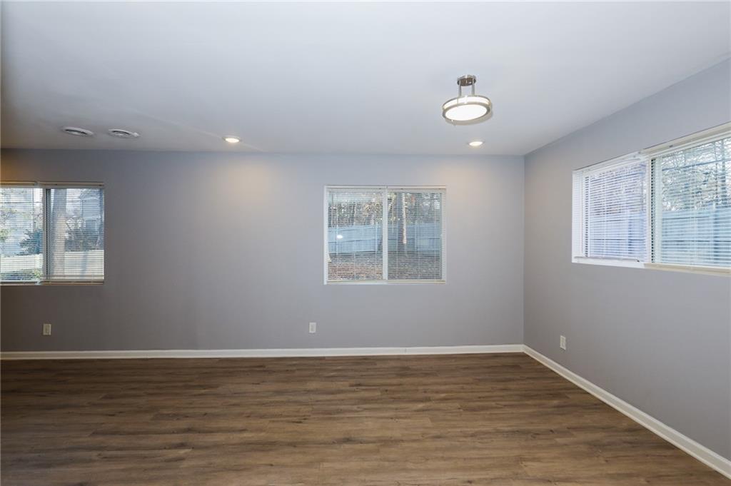1277 Goodwin Road Northeast, Unit 1273 Atlanta, GA 30324 - Photo 5 of 19 a view of a room with window and wooden floor