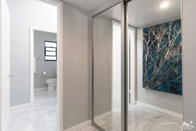 a view of a bathroom with a shower and a toilet
