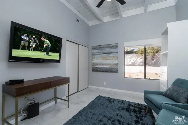 a bedroom with furniture and a window