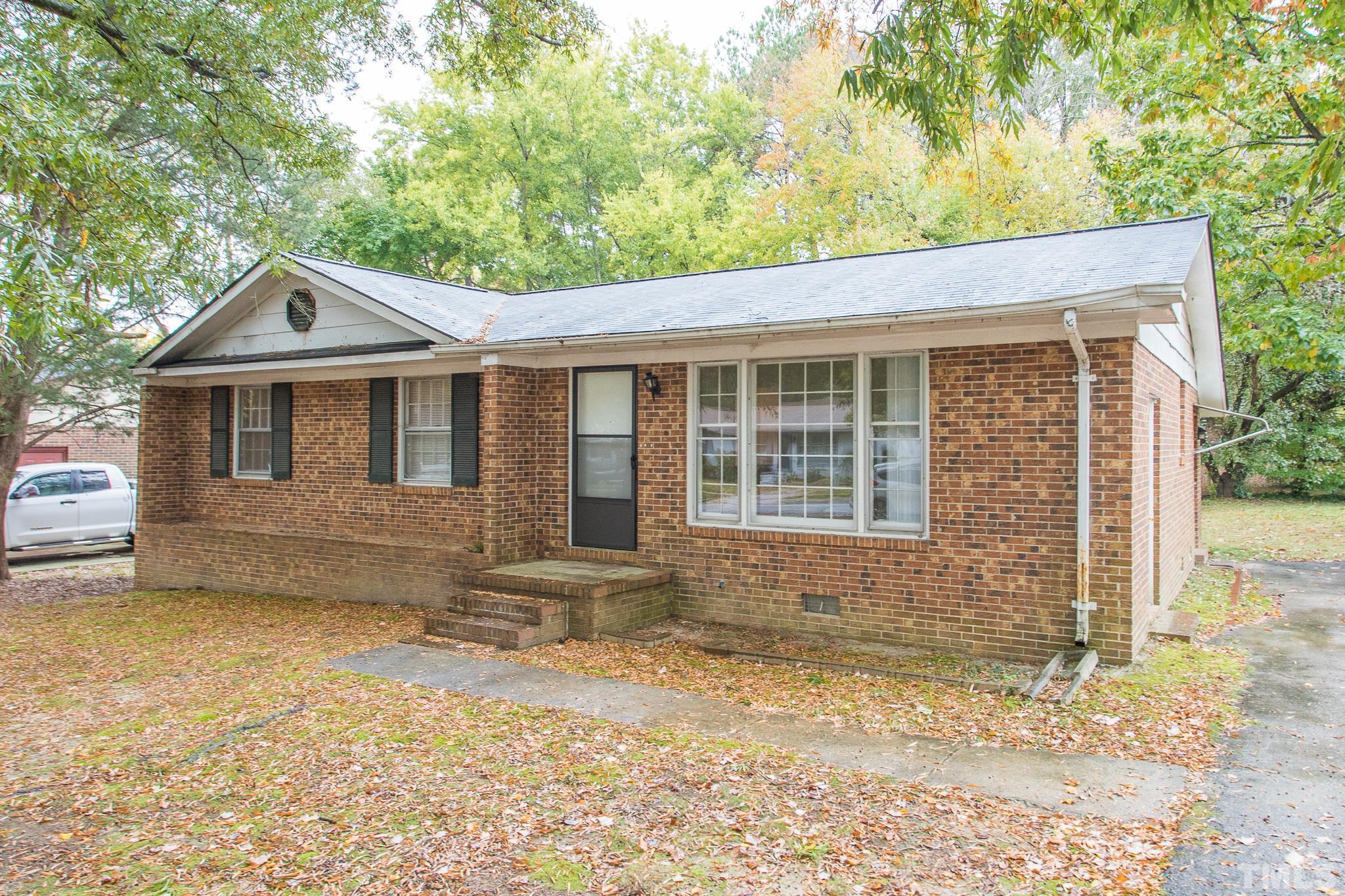 4413 Kilcullen Drive Raleigh, NC 27604 - Photo 1 of 21 a front view of a house with a yard