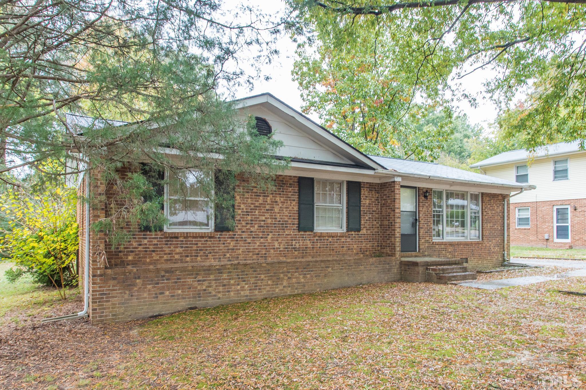4413 Kilcullen Drive Raleigh, NC 27604 - Photo 2 of 21 a backyard of a house with seating space