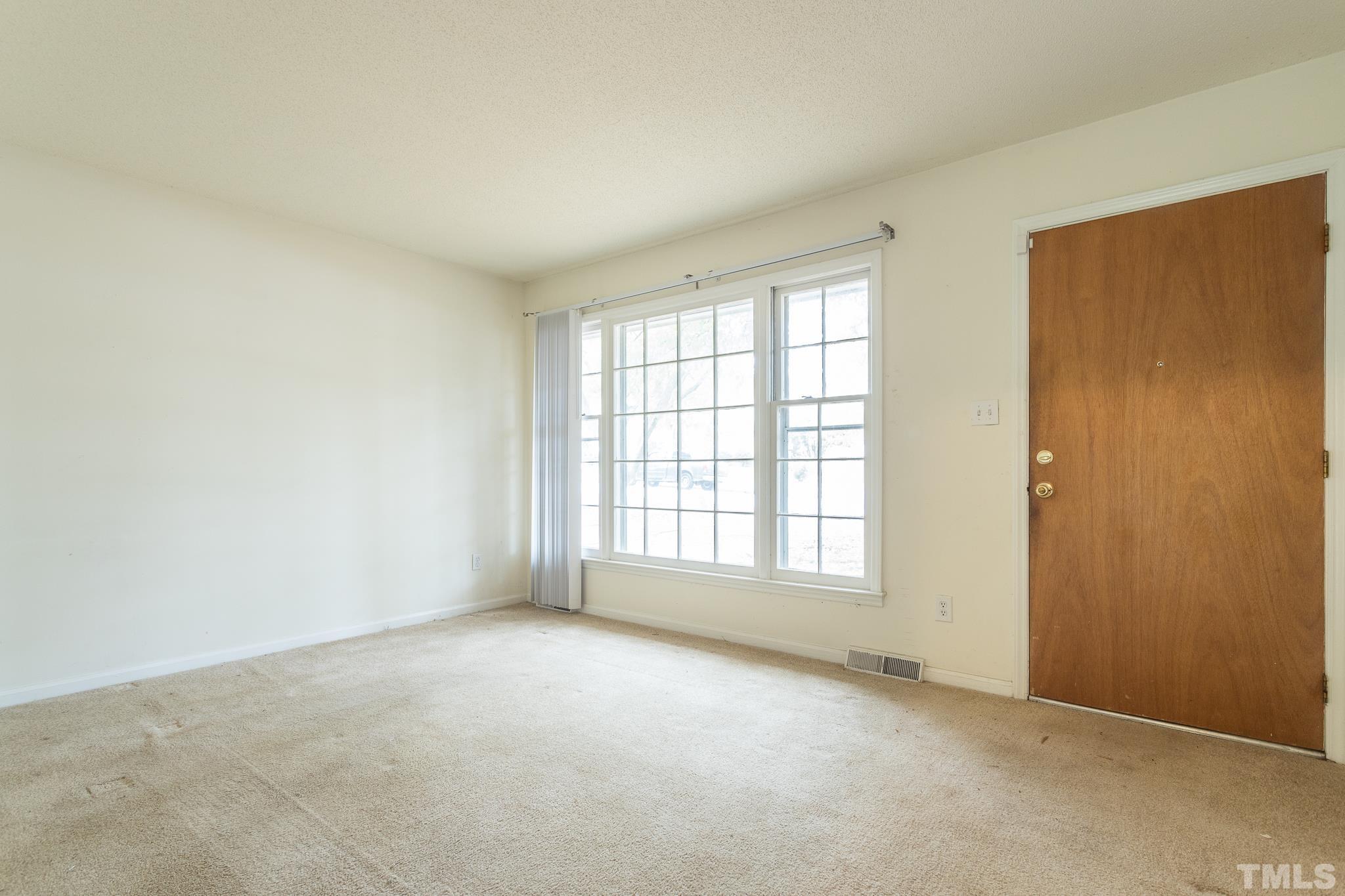 4413 Kilcullen Drive Raleigh, NC 27604 - Photo 11 of 21 an empty room with a window