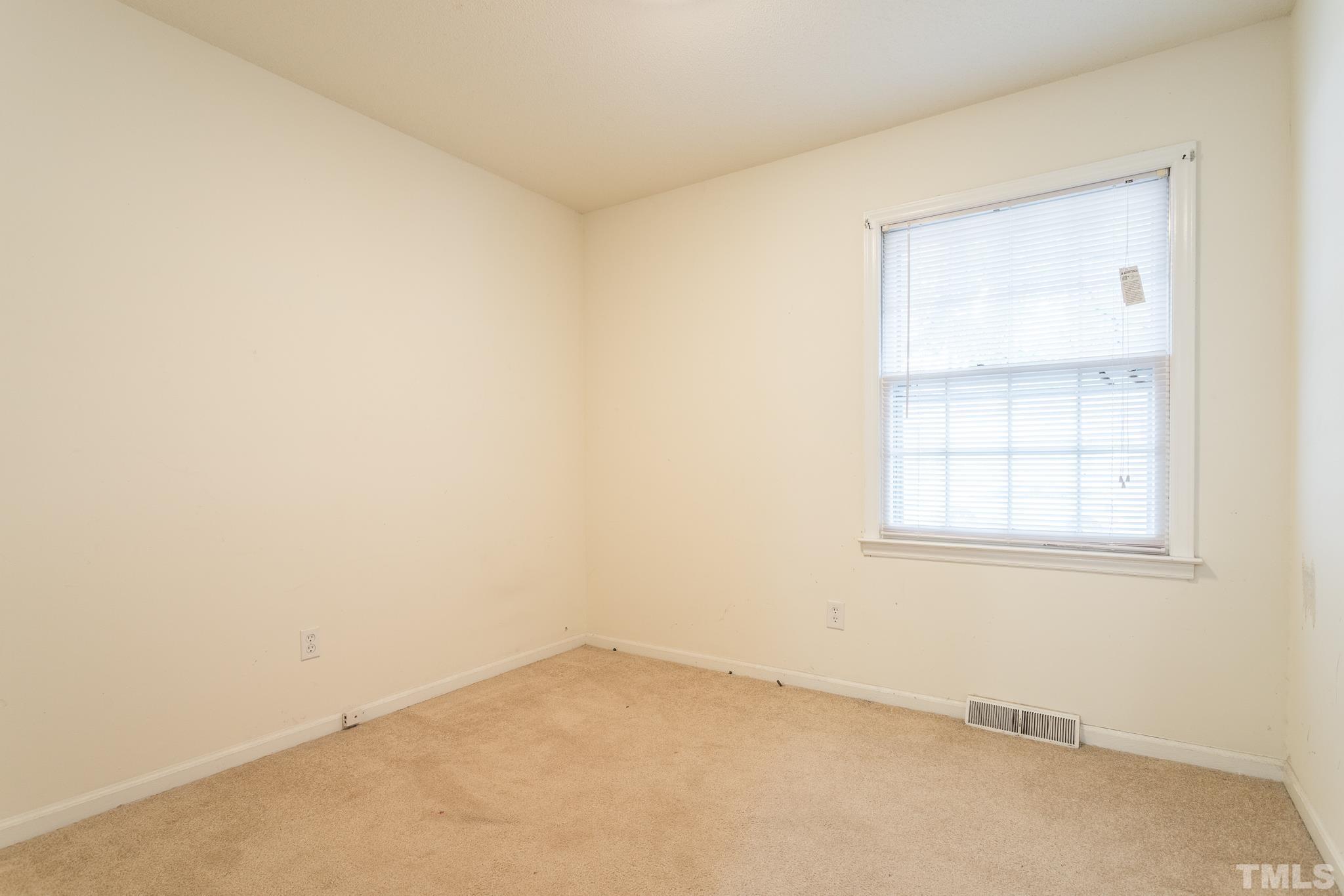 4413 Kilcullen Drive Raleigh, NC 27604 - Photo 21 of 21 an empty room with a window