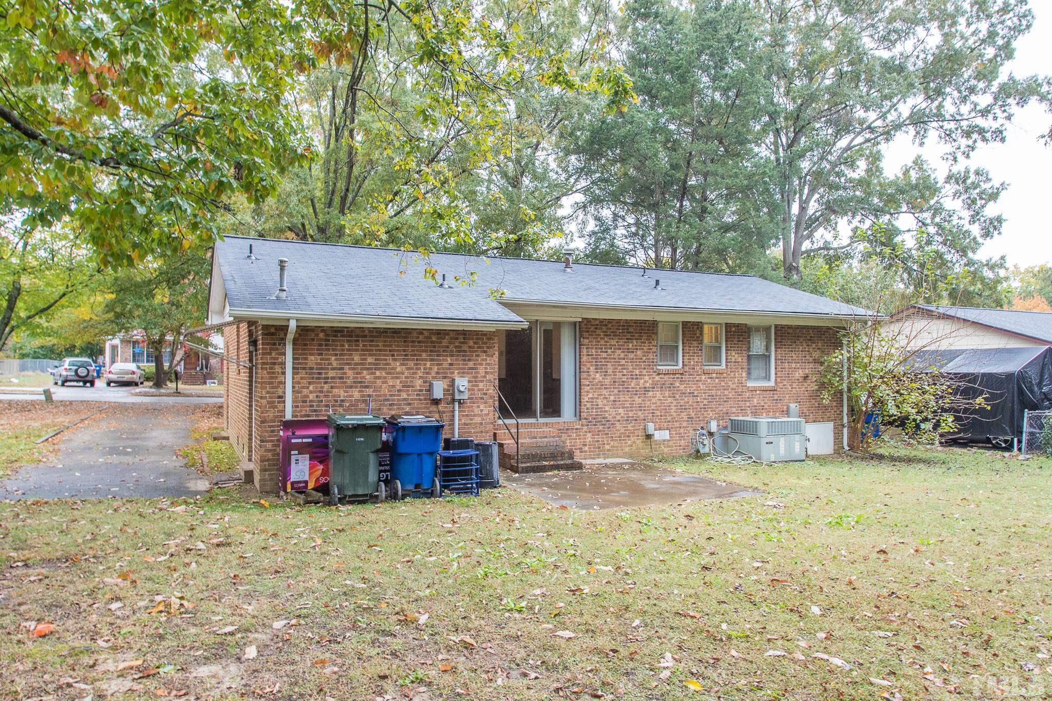 4413 Kilcullen Drive Raleigh, NC 27604 - Photo 4 of 21 a view of a house with a yard and sitting area