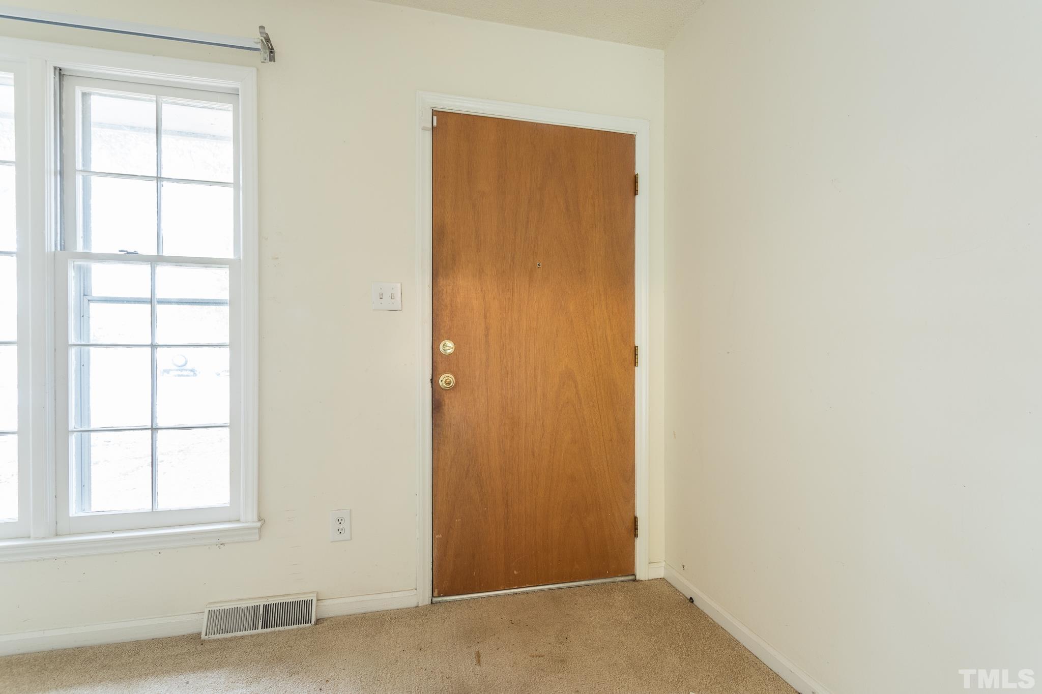 4413 Kilcullen Drive Raleigh, NC 27604 - Photo 8 of 21 an empty room with windows