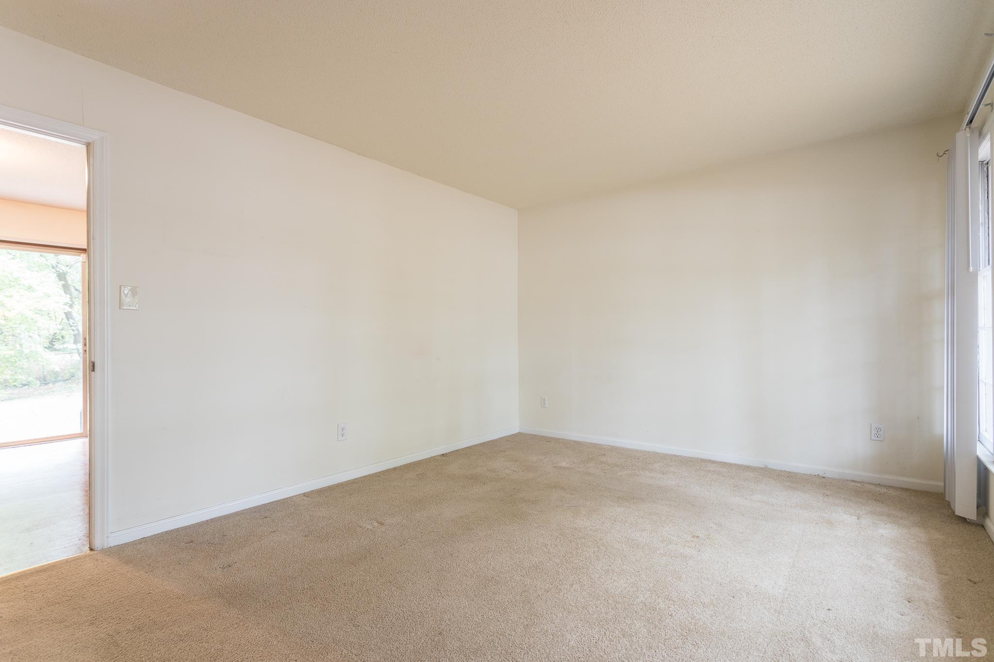 4413 Kilcullen Drive Raleigh, NC 27604 - Photo 9 of 21 an empty room with a window