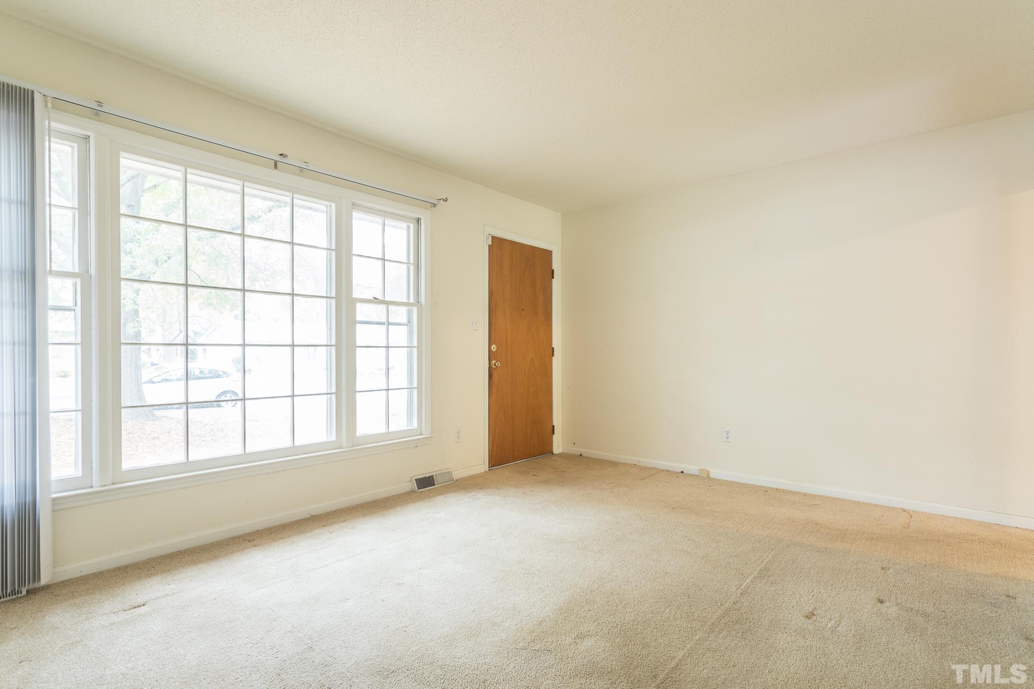 4413 Kilcullen Drive Raleigh, NC 27604 - Photo 10 of 21 an empty room with a window