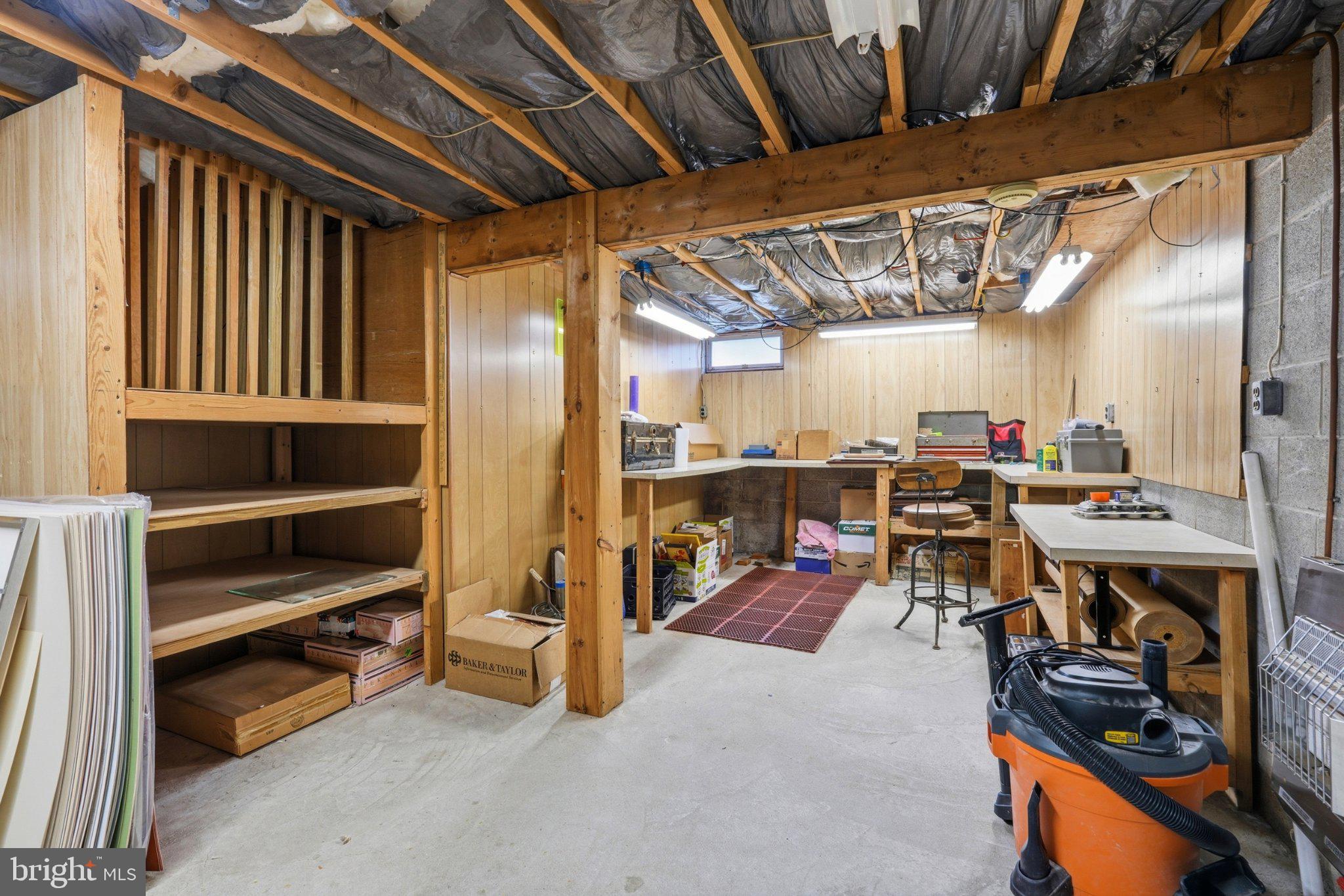 1385 Woodmere Road Pottstown, PA 19464 - Photo 42 of 63 Spacious basement with wooden accents.