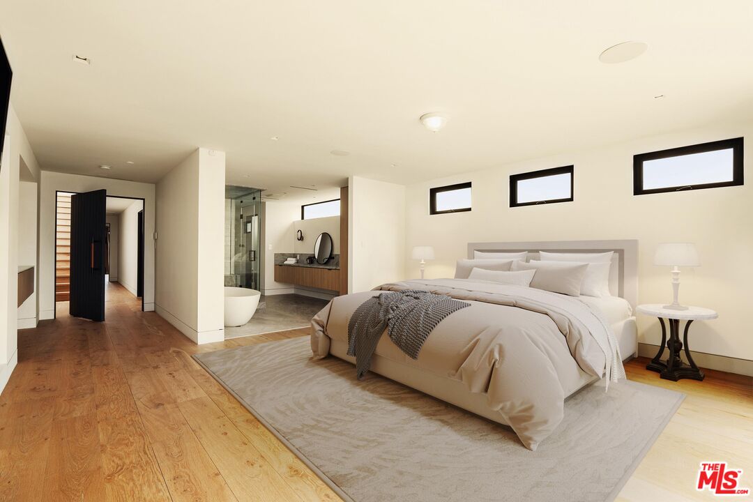 2205 Ocean Front Walk Venice, CA 90291 - Photo 13 of 30 a spacious bedroom with a bed and walk in closet