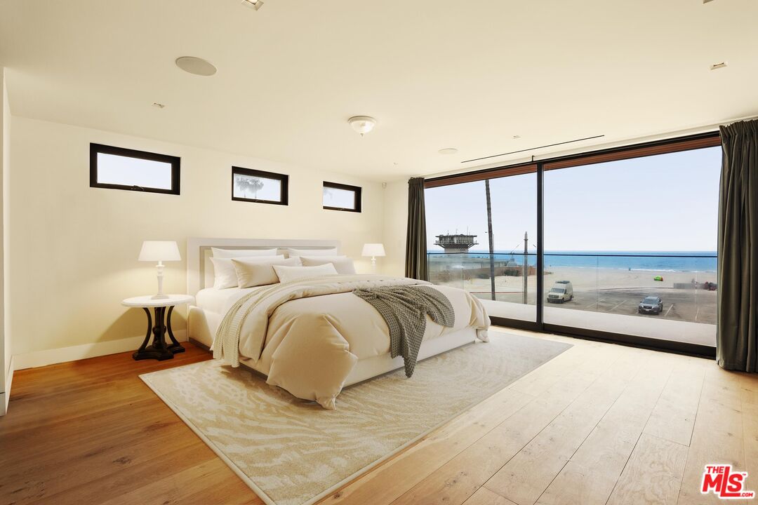2205 Ocean Front Walk Venice, CA 90291 - Photo 14 of 30 a spacious bedroom with a bed and a large window