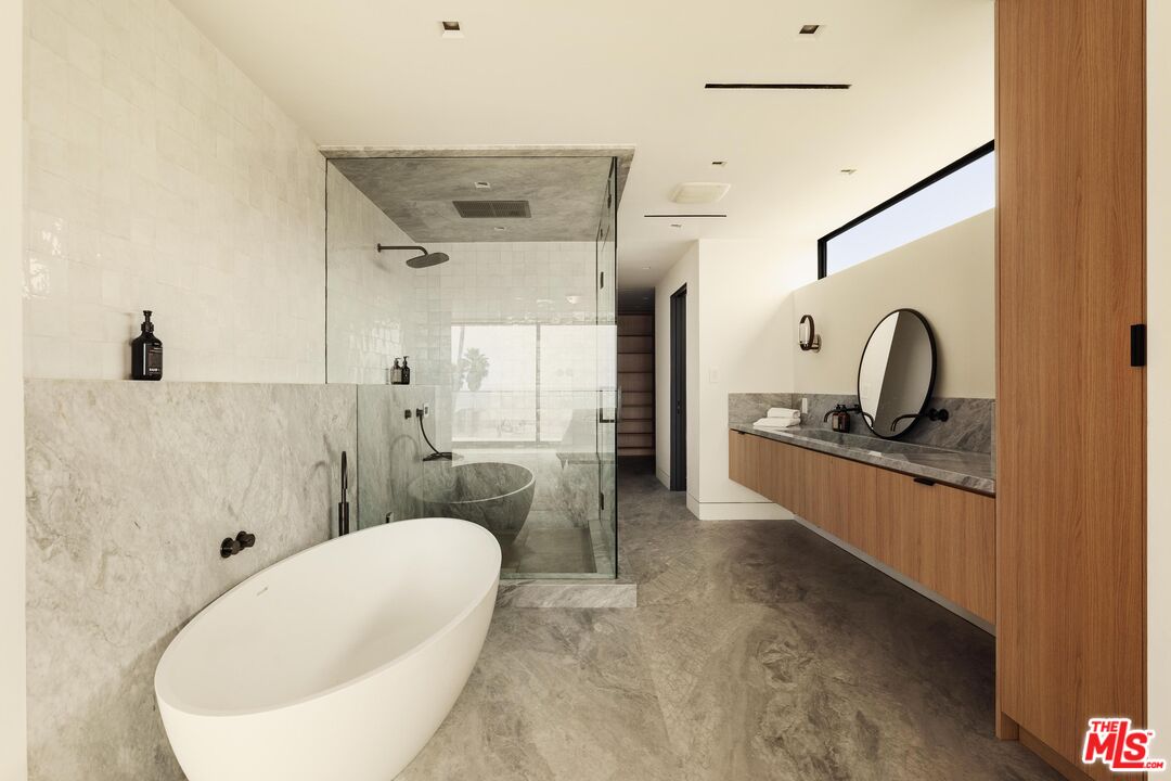 2205 Ocean Front Walk Venice, CA 90291 - Photo 17 of 30 a bathroom with a double vanity sink mirror and bathtub