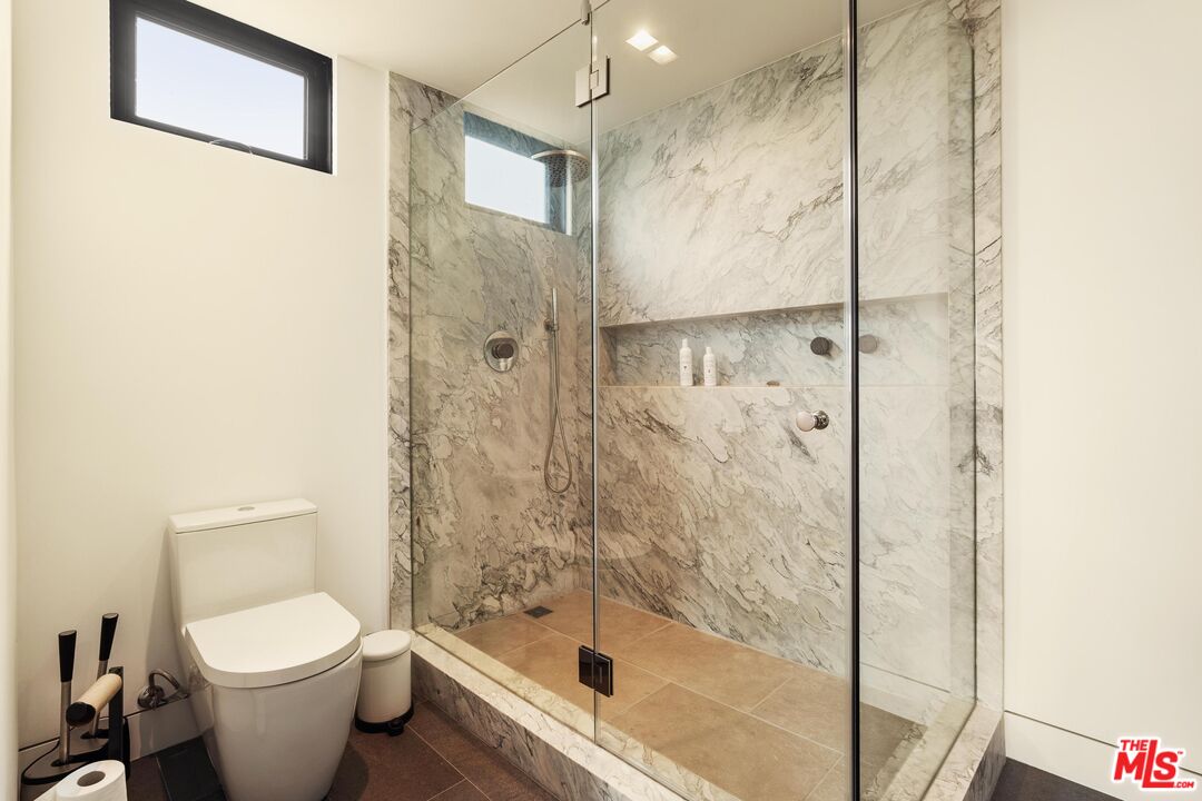 2205 Ocean Front Walk Venice, CA 90291 - Photo 22 of 30 a bathroom with a toilet and a shower