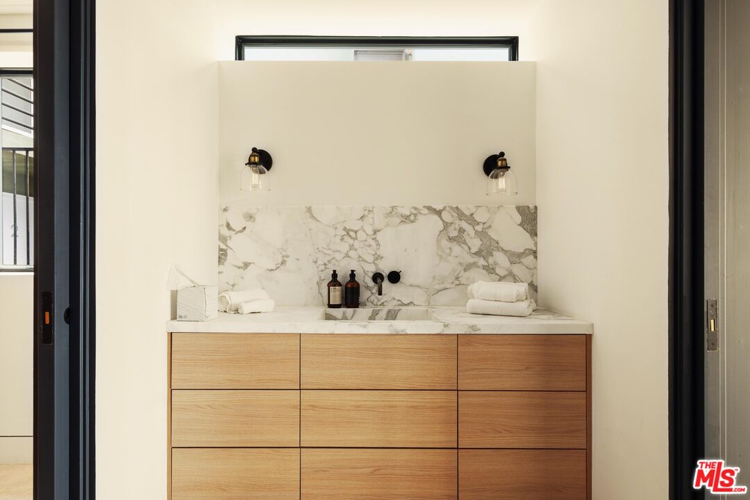 2205 Ocean Front Walk Venice, CA 90291 - Photo 25 of 30 a bathroom with a shower and a sink