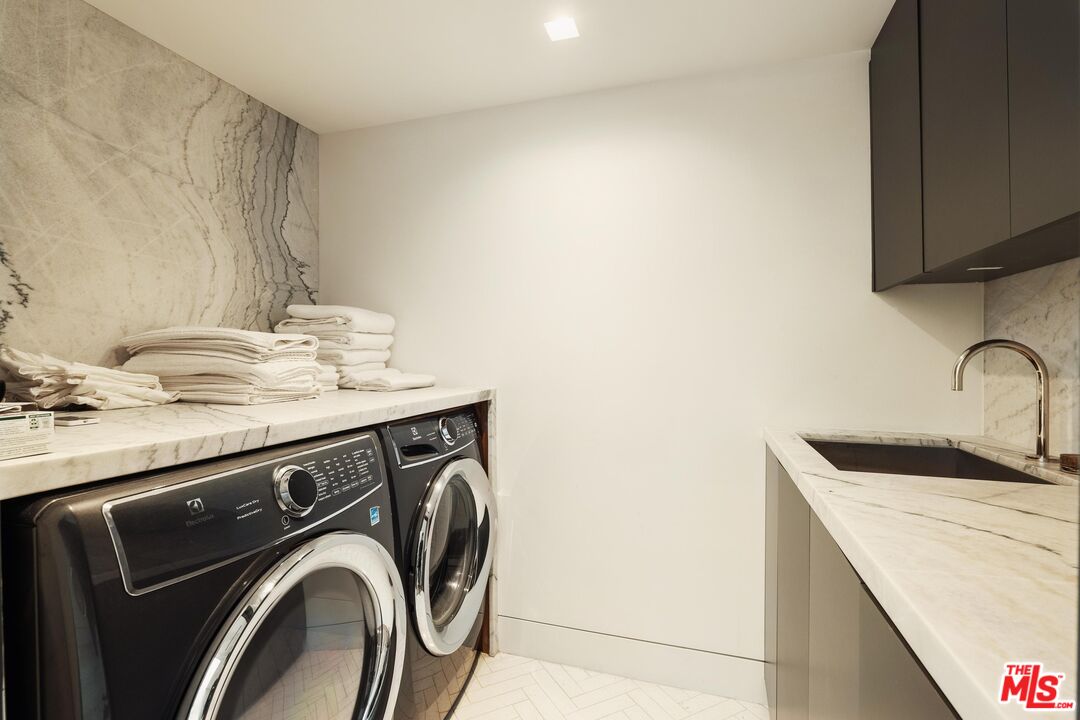2205 Ocean Front Walk Venice, CA 90291 - Photo 26 of 30 a utility room with sink dryer and washer