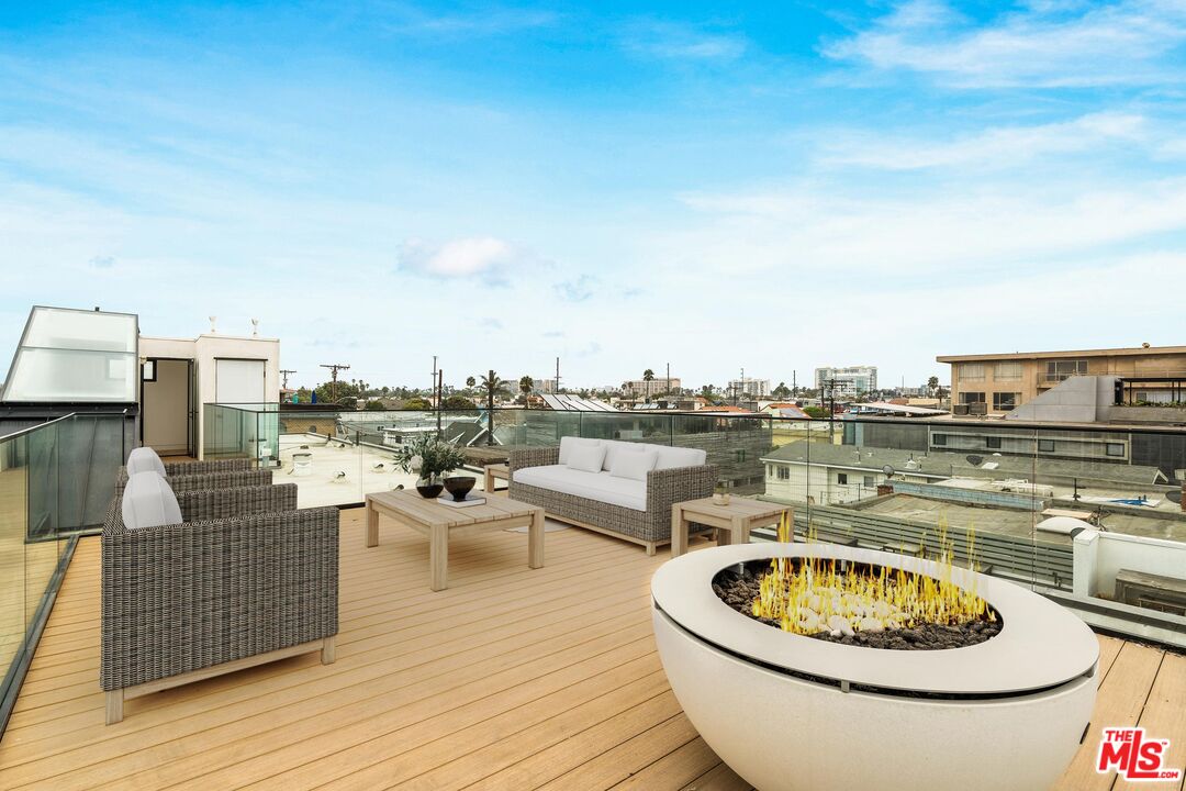 2205 Ocean Front Walk Venice, CA 90291 - Photo 28 of 30 a very nice looking dining room with a big room and wooden floor