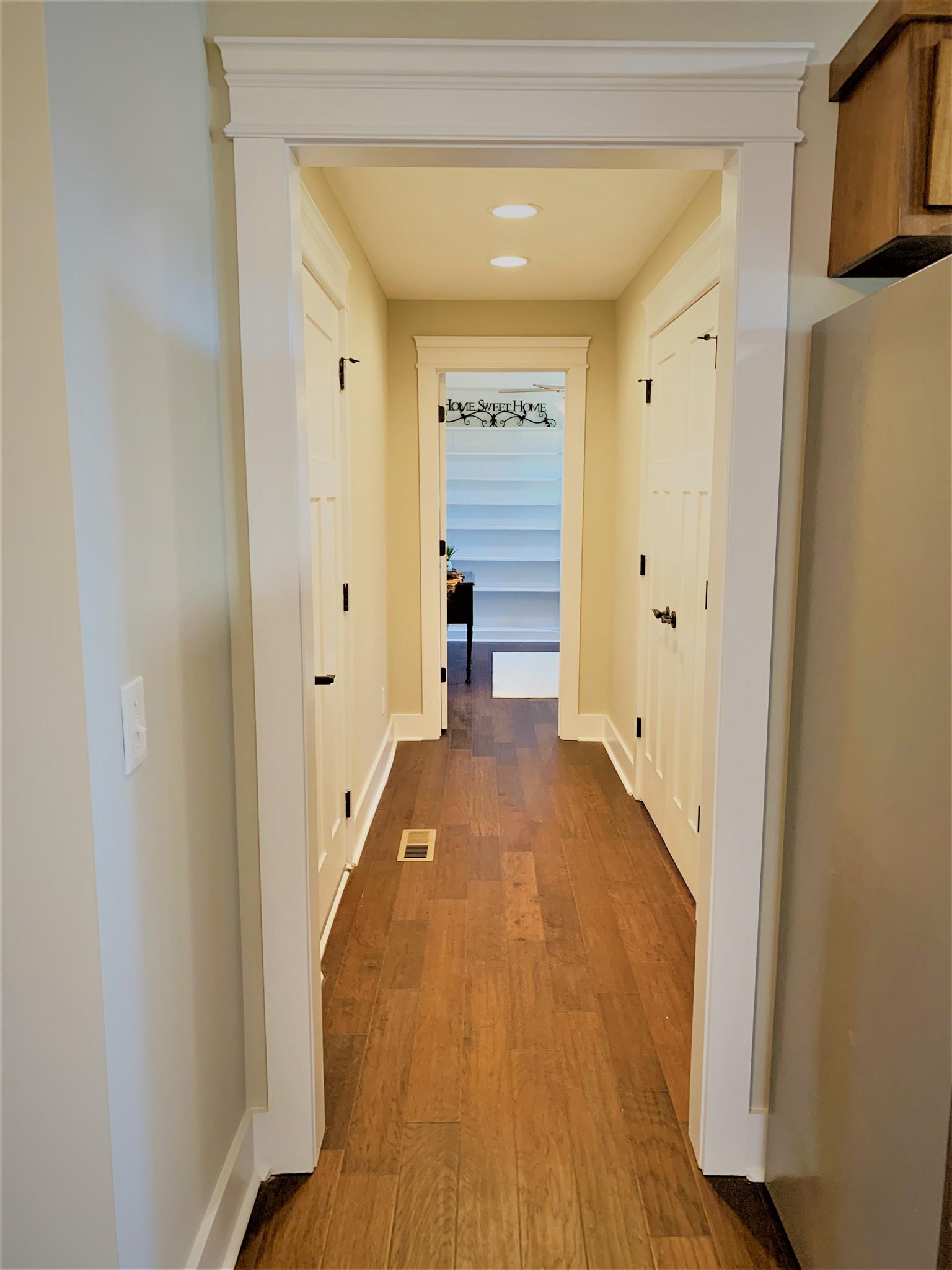 1360 Sixteenth Model Road Manchester, TN 37355 - Photo 20 of 30 a view of a hallway with wooden floor and furniture