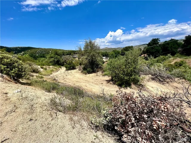 a view of a lake with a house in the background