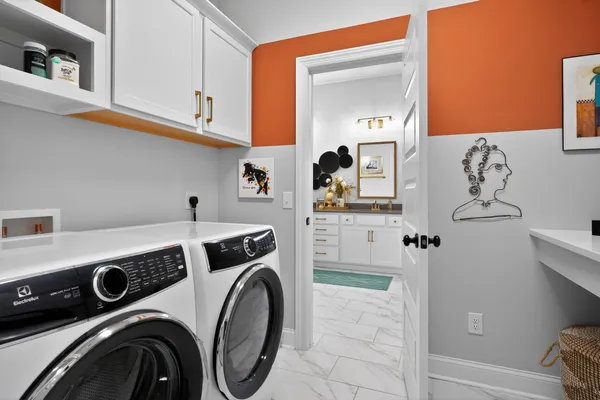 a utility room with dryer and washer