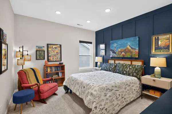 a bedroom with a bed and dresser