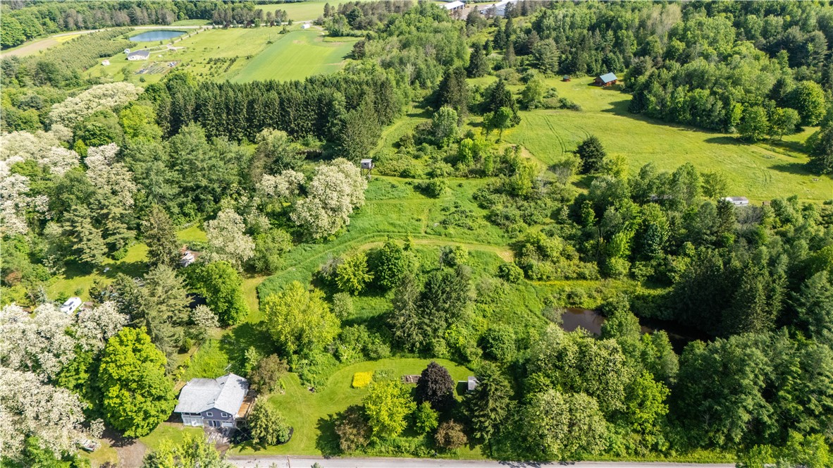 Front view of property with some acreage