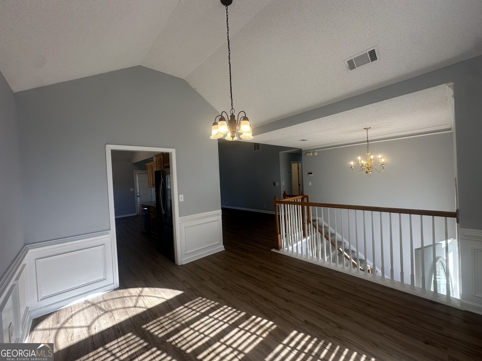 1664 Pinto Trail Jonesboro, GA 30236 - Photo 11 of 31 a view of a hallway with a chandelier