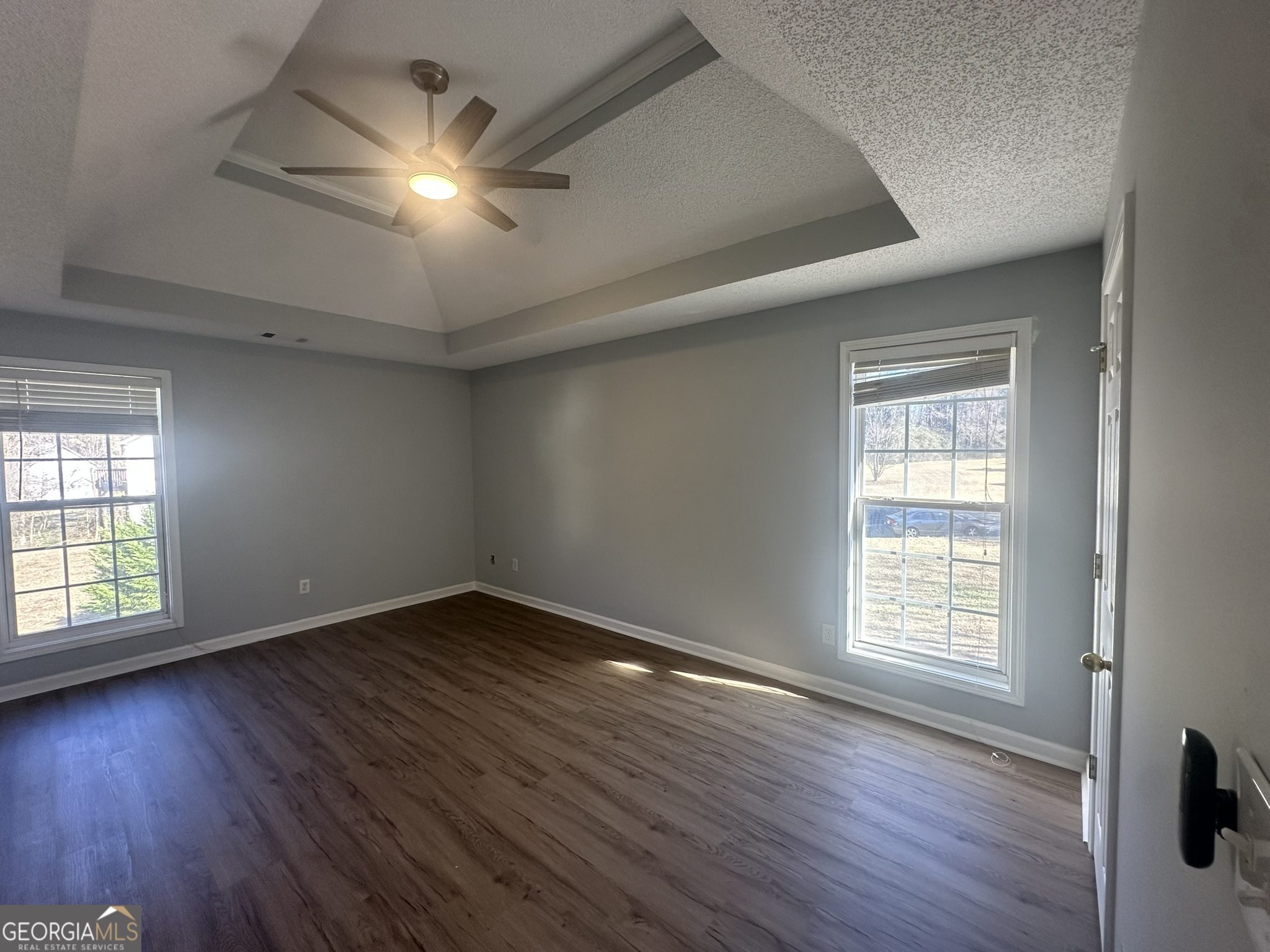 1664 Pinto Trail Jonesboro, GA 30236 - Photo 19 of 31 an empty room with wooden floor and windows