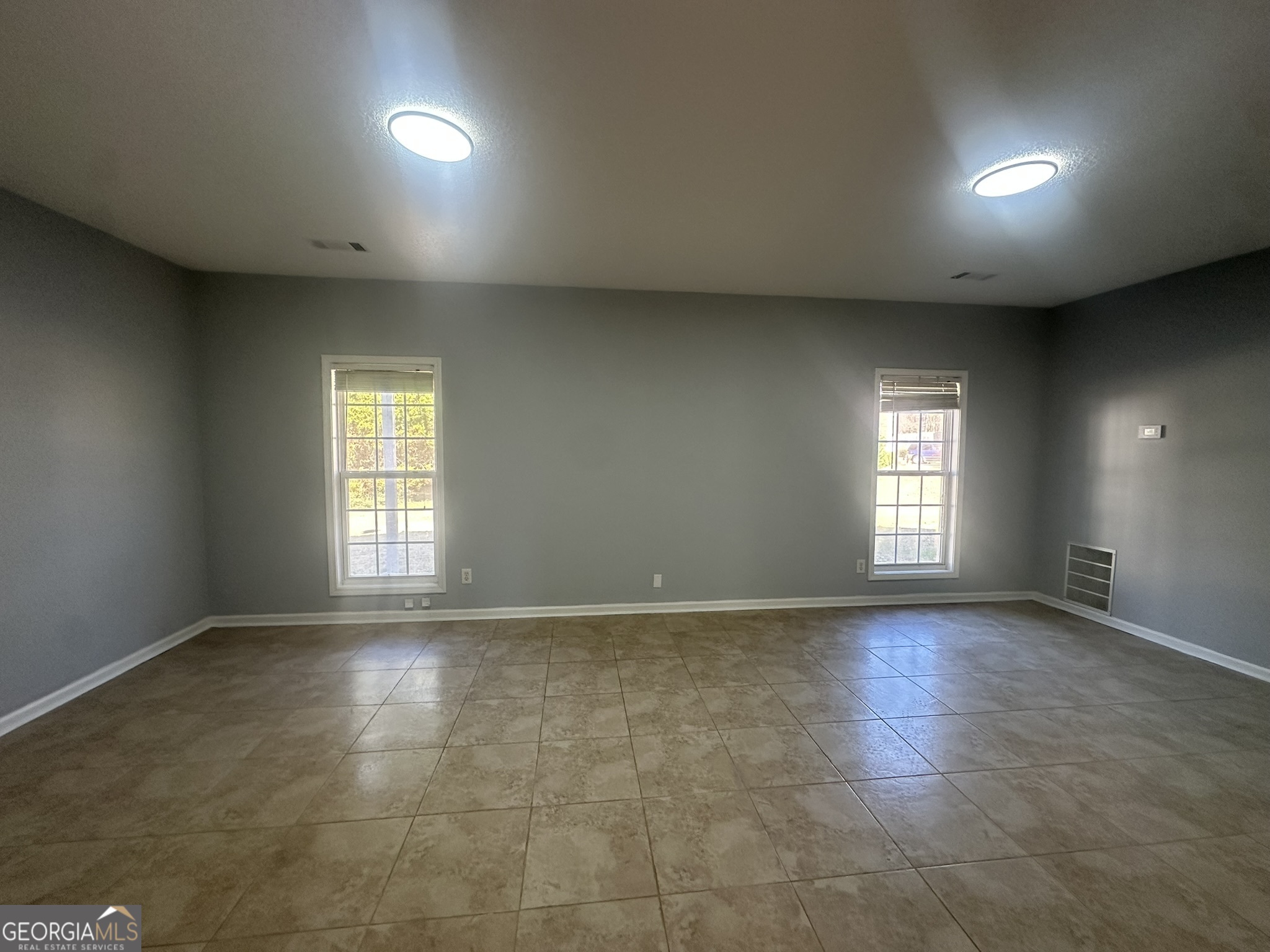 1664 Pinto Trail Jonesboro, GA 30236 - Photo 28 of 31 a view of an empty room and a windows