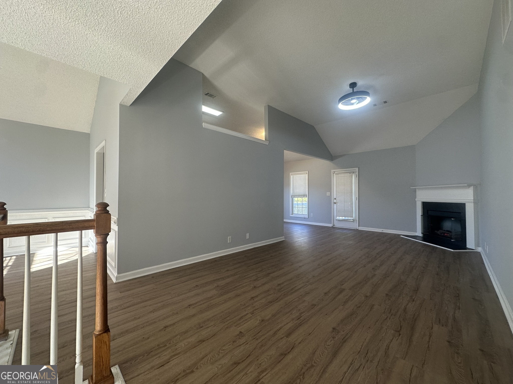 1664 Pinto Trail Jonesboro, GA 30236 - Photo 6 of 31 a view of an empty room with wooden floor and a window