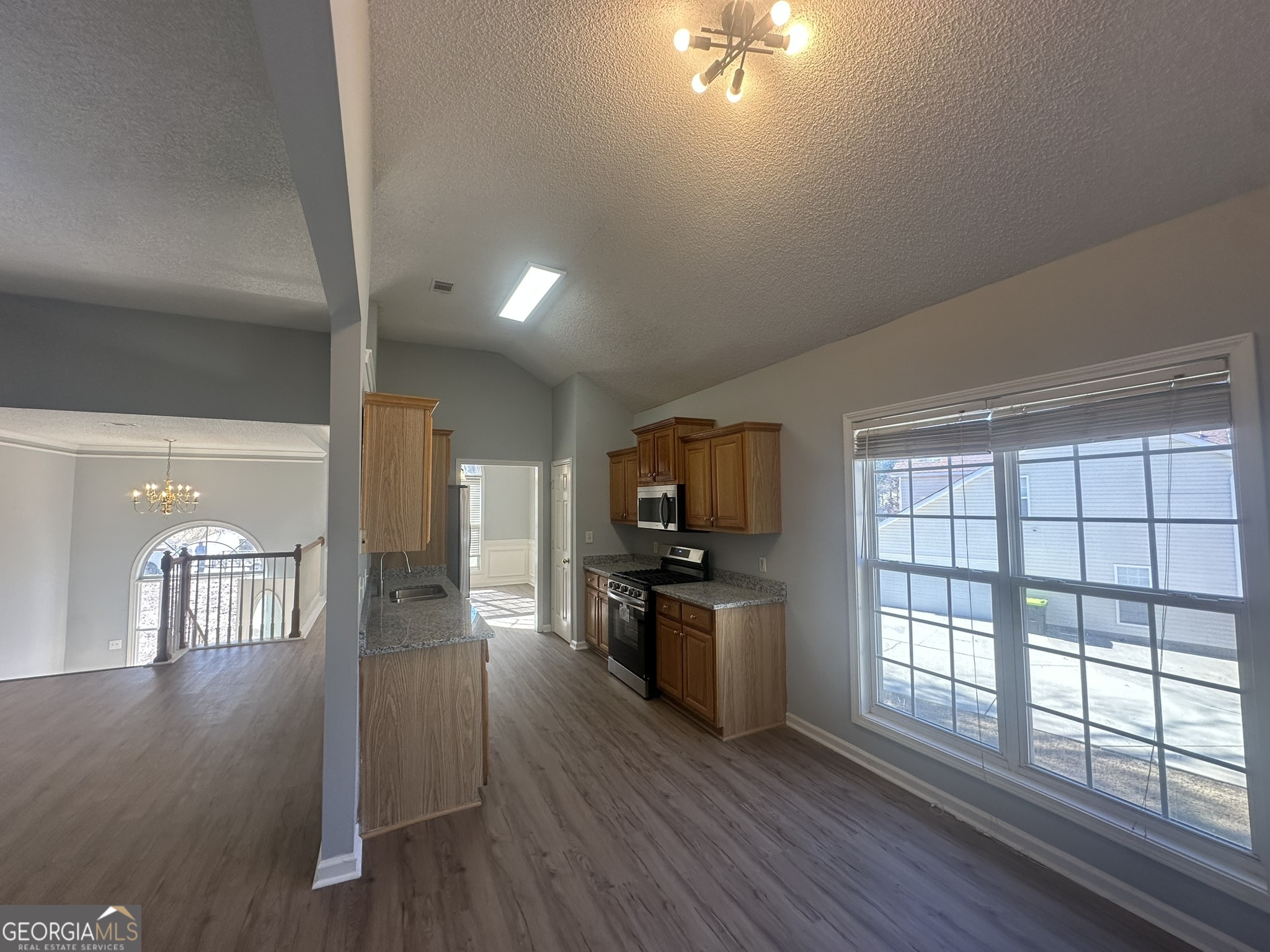 1664 Pinto Trail Jonesboro, GA 30236 - Photo 9 of 31 a view of a living room kitchen and a wooden floor