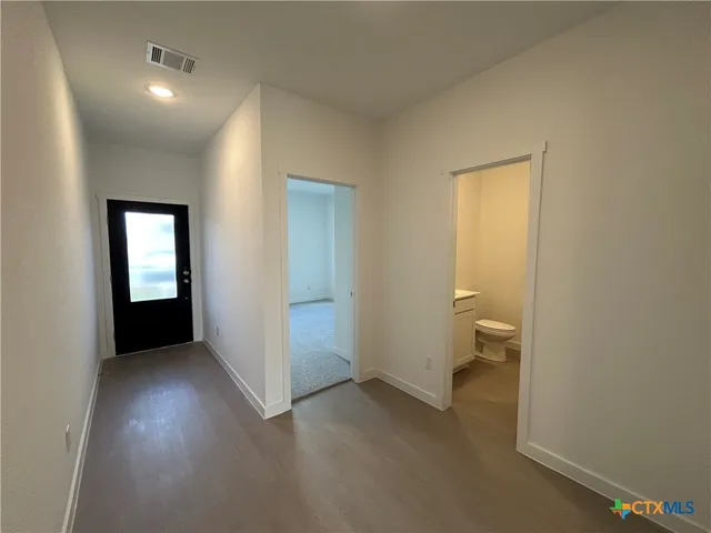 a kitchen with a sink cabinets and stainless steel appliances