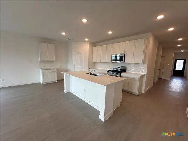 a view of kitchen with windows