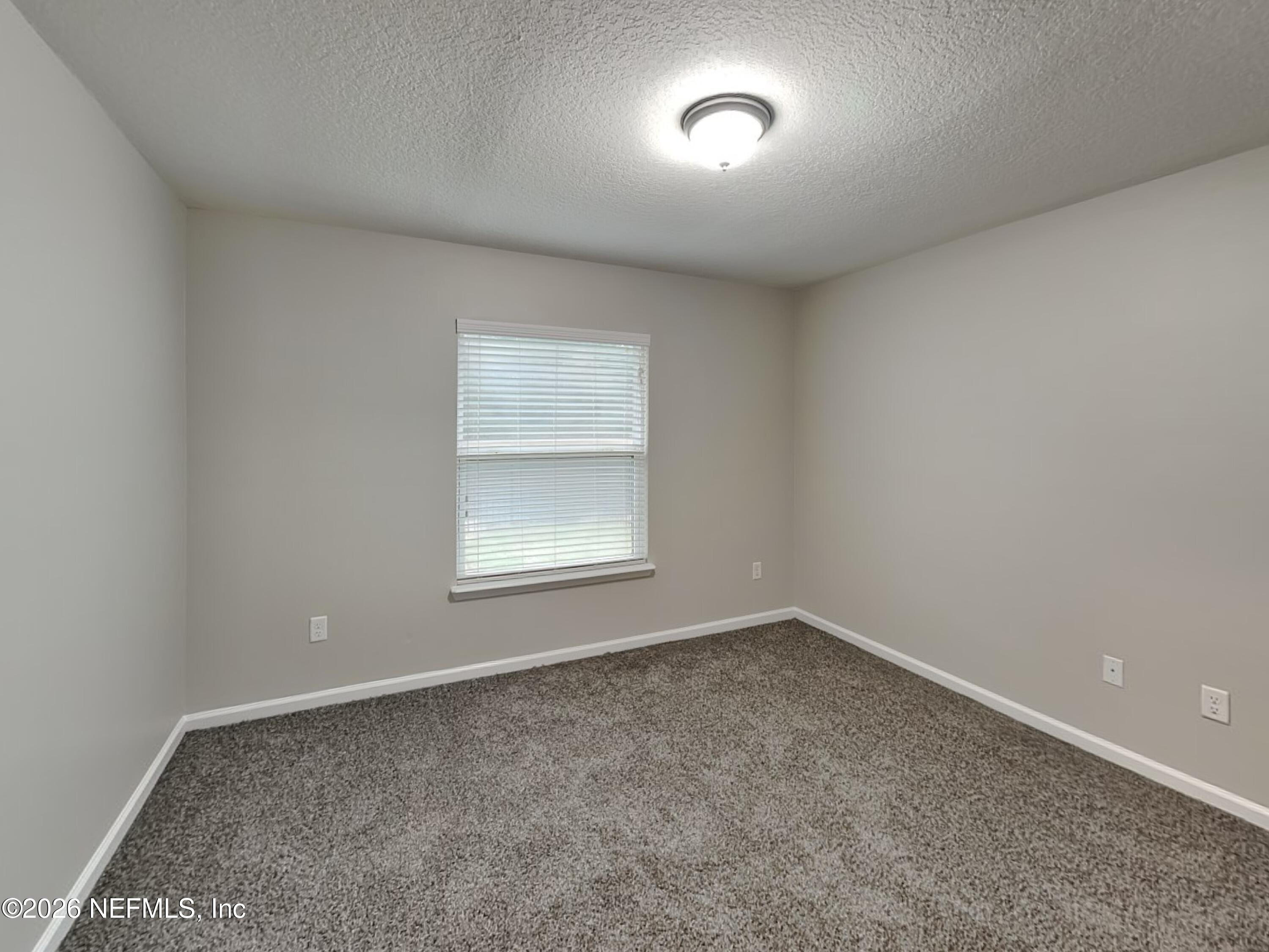 83245 Purple Martin Drive Yulee, FL 32097 - Photo 12 of 23 10_Bedroom-01_Image_Qd7UI8JRv8