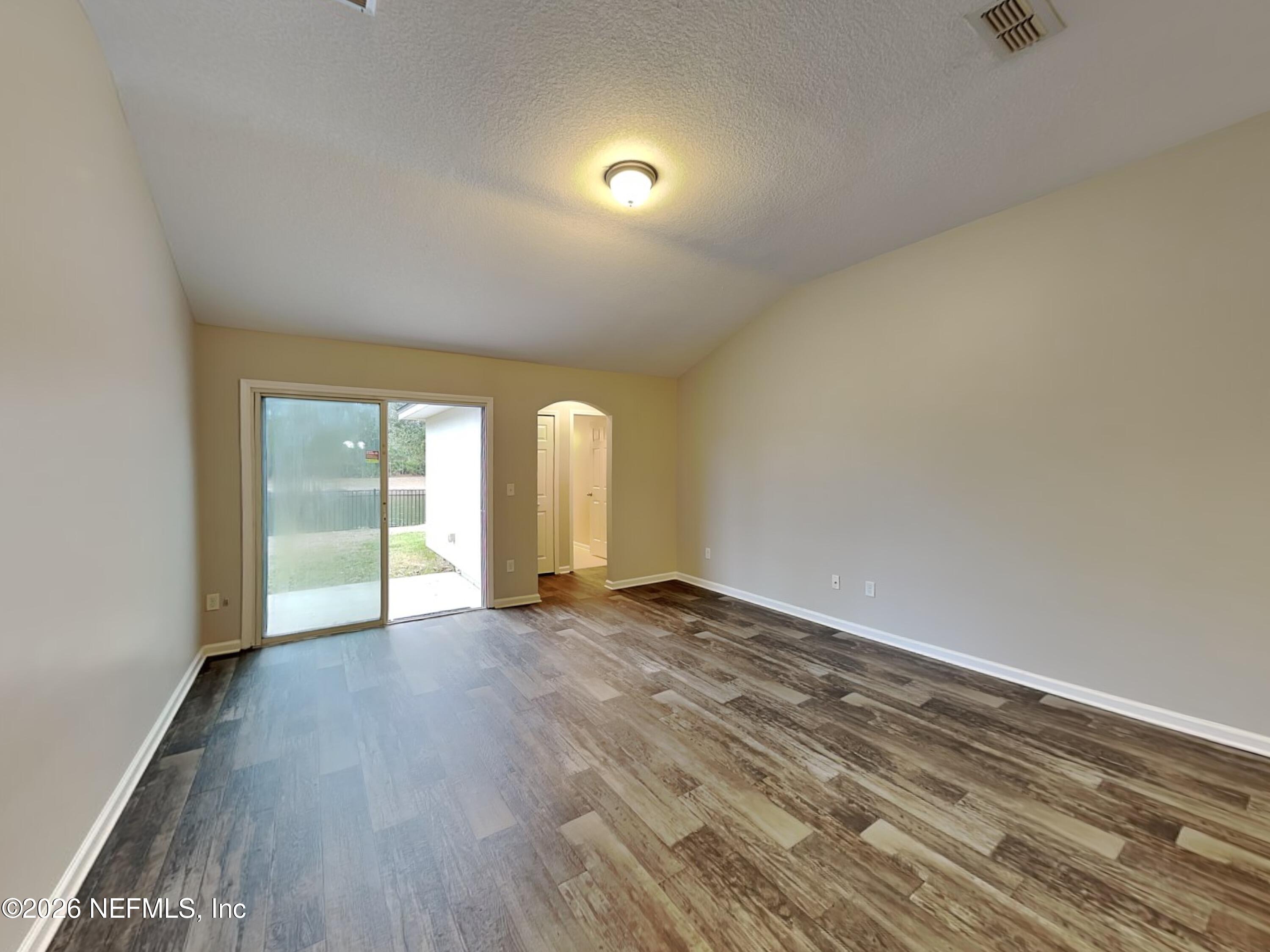 83245 Purple Martin Drive Yulee, FL 32097 - Photo 4 of 23 2_Living_Room-01_Image_TzM6R2hJGf