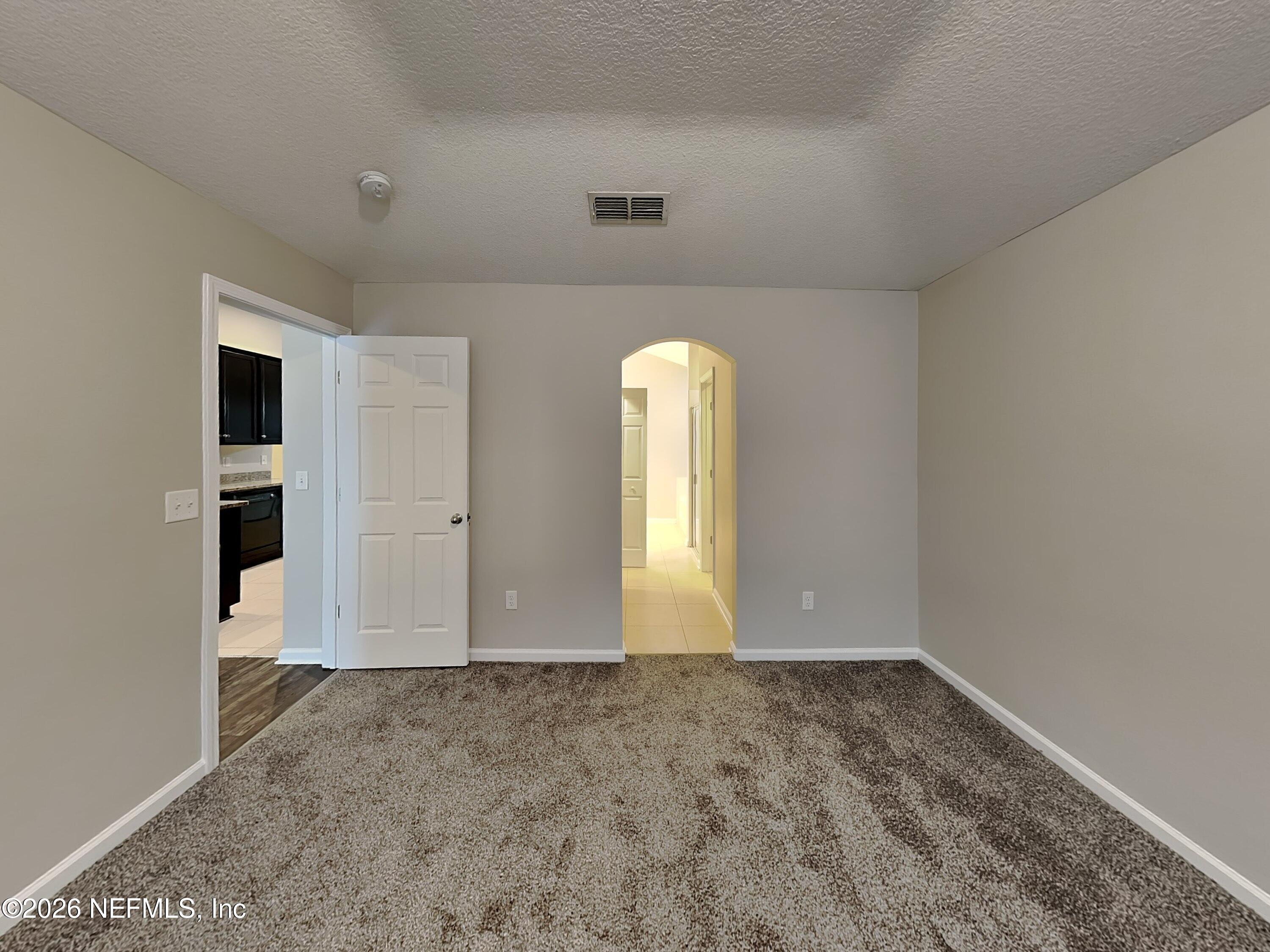 83245 Purple Martin Drive Yulee, FL 32097 - Photo 9 of 23 7_Bedroom-02_pc_HbQW4PVHtI_AxfCRaE4l1_la